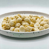 Ahualoa Pineapple & Coconut Macadamia Nuts on a serving dish