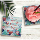 "Don't Worry, Beach Happy" tile beverage coaster with beverage and another coaster.