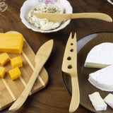 Totally Bamboo Cheese Knife Set with a variety of cheeses