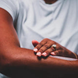 Applying Ola "Coconut" Body Butter to Arm