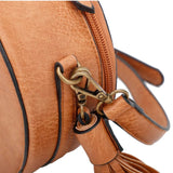 Ampere Creations "Suzie" Round Crossbody Bag- Brown Showing Metal Strap Clips