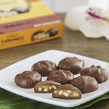 Hawaiian Host "Maui Caramacs" Chocolate & Caramel Macadamia Nuts arranged on serving dish