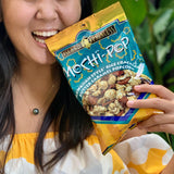 Model holding Island Princess Mochi-Pop Popcorn Snack, 2.5-Ounce Bag