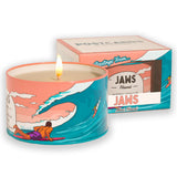 It's Paradise "Maui Jaws" Candle with wick burning next to a packaged candle