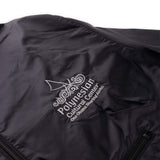 Polynesian Cultural Center Rain Jacket with Zipper Pouch- Closeup on embroidered logo.