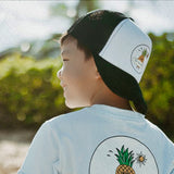 Young boy wearing Reign + Skye "Ride the Waves" Kid's Trucker Hat