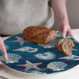 "Jewels of the Sea" Tempered Glass Counter Saver with loaf and slices of bread.