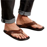 Model wearing OluKai Men's "Mea Olu" Sandals- Tan/Dark Java