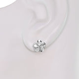 Sterling Silver Plumeria Earrings with a Cubic Zirconia Stone shown on a mannequin's ear