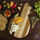 Totally Bamboo Shiplap Pineapple Serving/Cutting Board with cheeses and surrounded by other food items