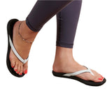 Model wearing OluKai Women's Ho'opio Sandals - White/Onyx 